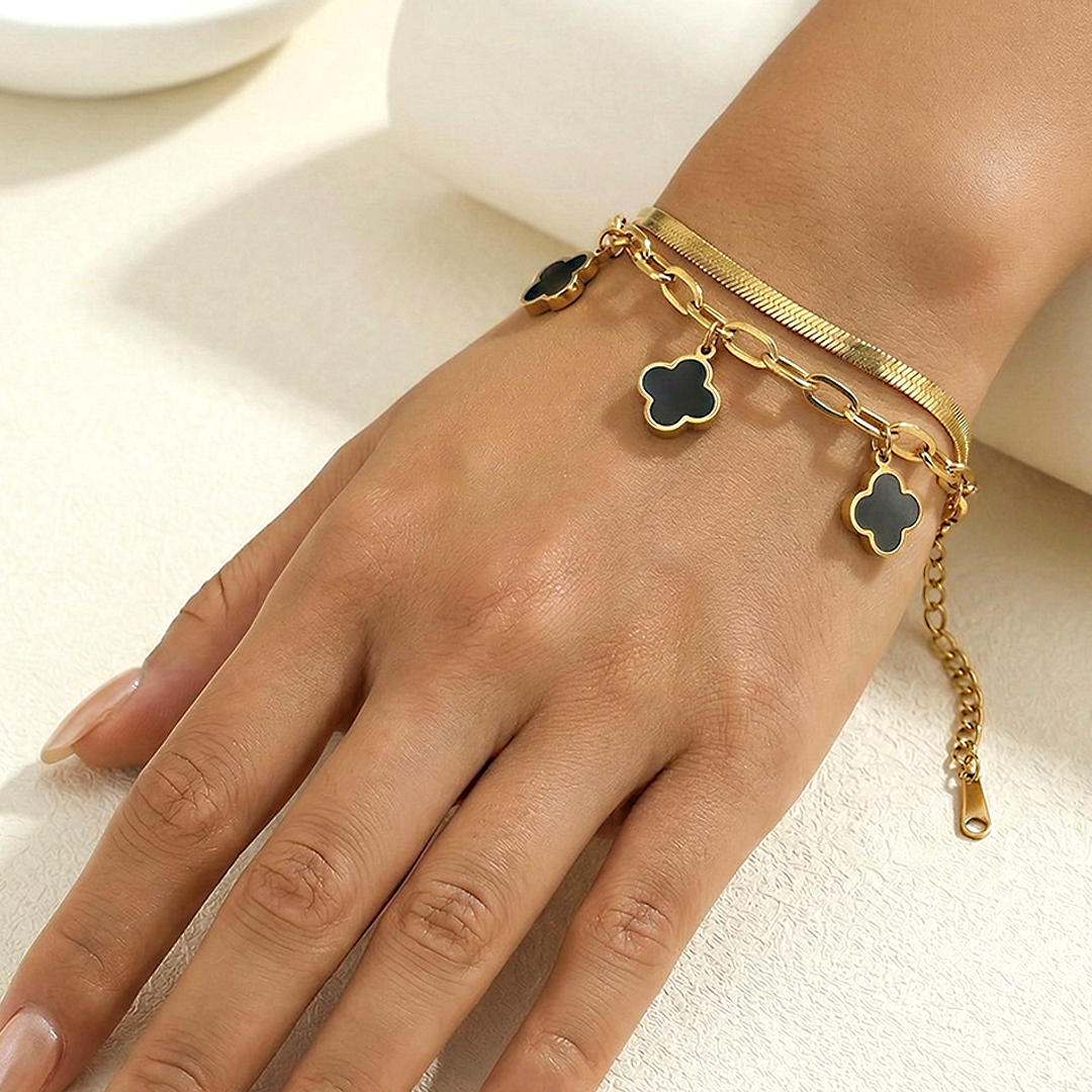 gold bracelet with black clover charms Pakistan
